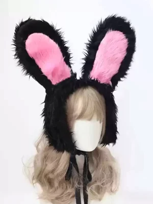 Black and pink plush rabbit ear lolita headdress shown on mannequin with light brown curly wig, featuring black outer ears with pink inner ears and black tie straps, front view sweet rococo style