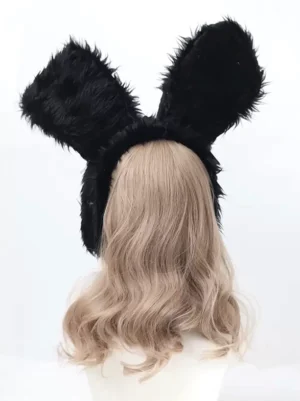 Back view of black plush rabbit ear lolita headwear on mannequin displaying hidden black tie straps, sweet rococo color block accessory rear perspective