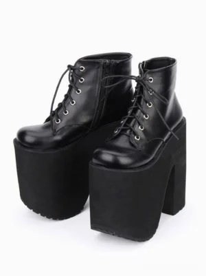 Black platform ankle boots three-quarter side view side zipper metal lace eyelets ultra chunky platform heel gothic lolita style