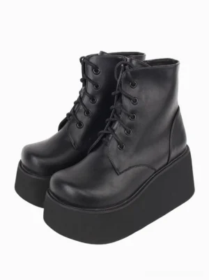 Black platform Gothic Lolita boots pair three-quarter front view showing round toe shape, lace-up closure, and thick flatform sole in studio setting