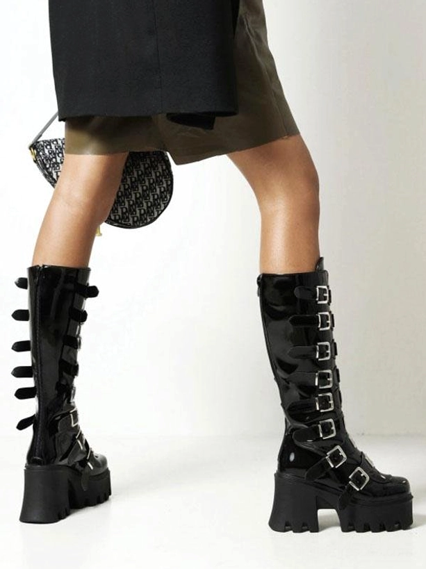 Black Lolita boots rear side view on model wearing showing chunky block heel side-mounted buckle straps and substantial platform construction