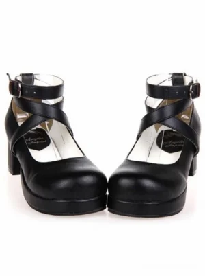 Black platform lolita heels with rounded toe and chunky heel, front view showcasing matte PU leather and cross ankle straps, classic lolita shoes