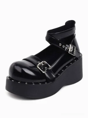 Black platform Mary Jane Lolita shoes front three-quarter view showcasing glossy PU leather finish, dual silver buckle straps, and studded wedge sole design
