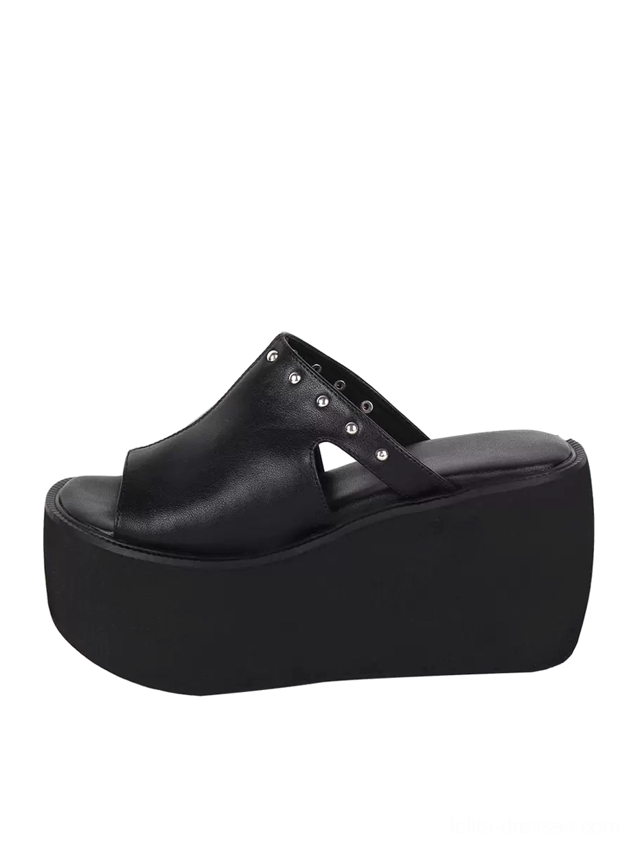 Black platform slide sandal rear three-quarter view vamp cutout studded strap chunky platform sole gothic footwear