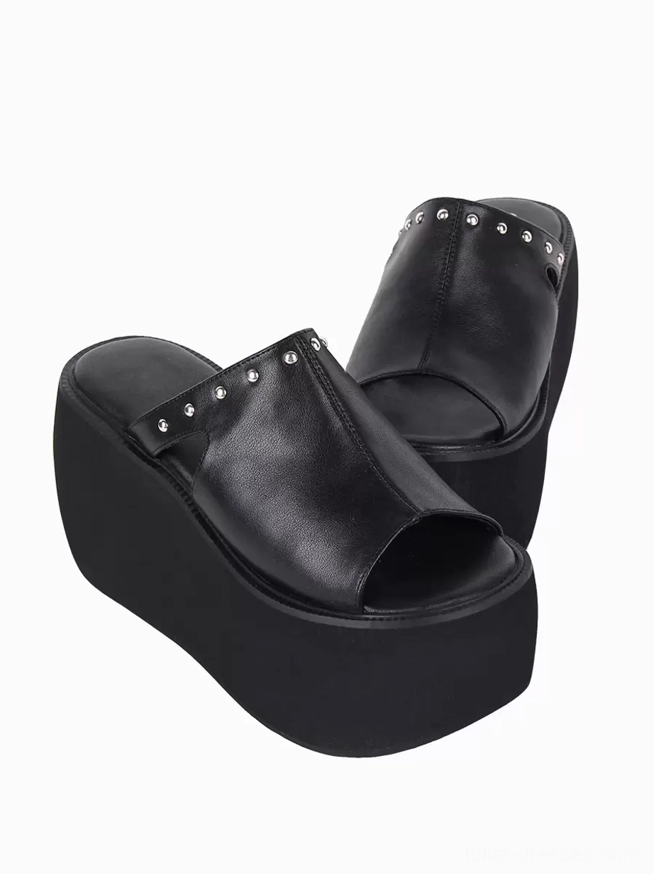 Black platform slide sandals angled side view silver round rivets open toe high thick platform sole gothic fashion