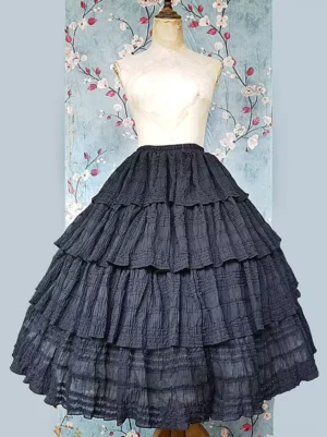 Black pleated chiffon lolita skirt with tiered ruffles front flat lay showing multi-layered design and delicate pleating details