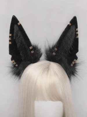 Black plush animal ear headband with gold metal studs worn on blonde wig mannequin, front view display showing fluffy ear base and stud embellishments for lolita fashion styling