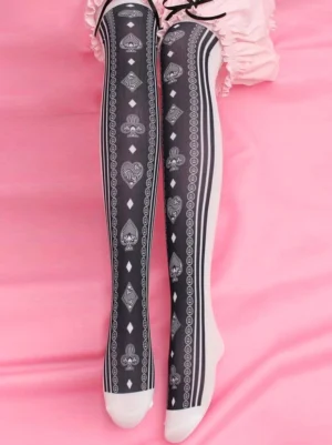 black-poker-print-over-the-knee-lolita-socks-white-stripe-overhead-view-on-pink-bedding