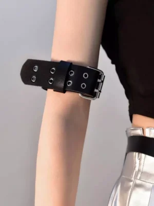 Black PU leather steampunk lolita arm harness with silver metal buckle and adjustable eyelets worn on female arm with gothic styling