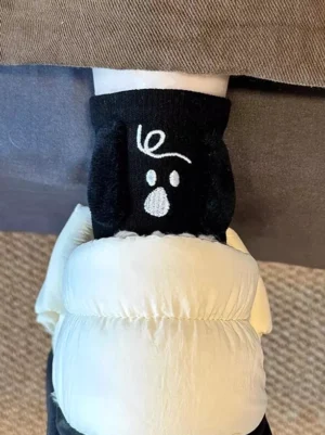 Black 3D puppy plush lolita socks with flocked dog ears and embroidered face worn on feet with puffy down pants, sweet lolita hosiery style