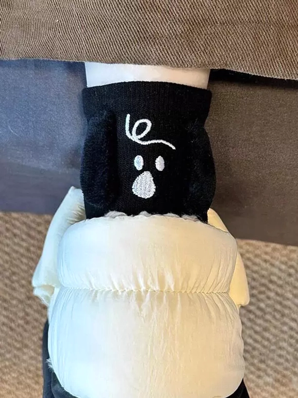 Black 3D puppy plush lolita socks with flocked dog ears and embroidered face worn on feet with puffy down pants, sweet lolita hosiery style