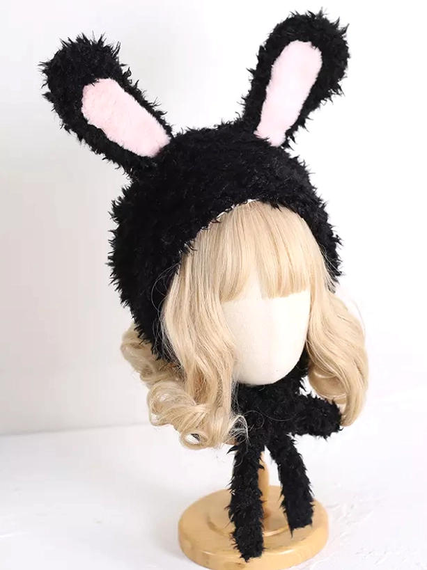 Close-up front view of black rabbit ear Lolita hat showing rounded ears with pink inner details