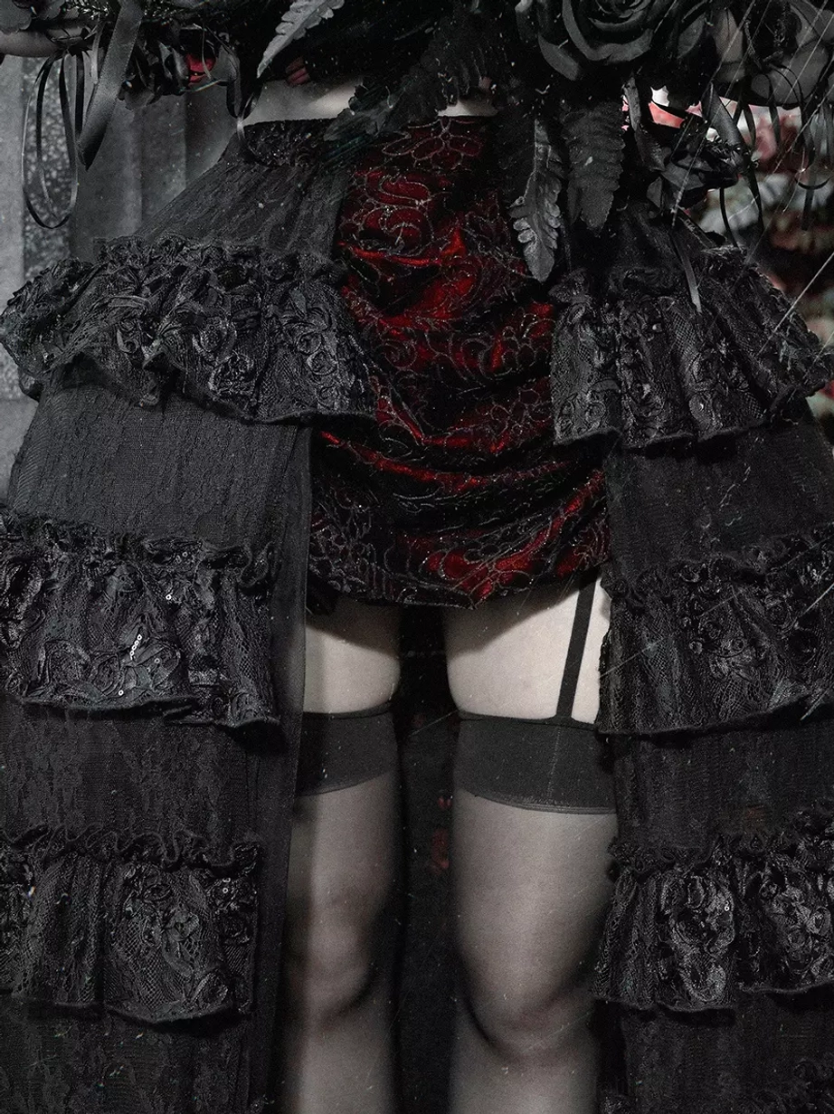 Gothic lolita skirt with black and red colorway displaying high-waisted fit, tiered ruffled hem construction, and elegant dramatic train for alternative fashion styling
