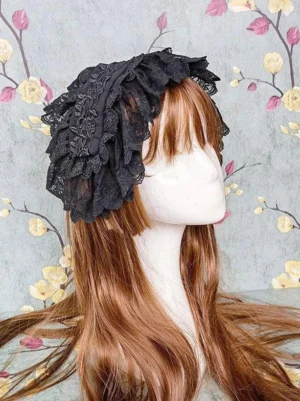 Black Rococo Lolita headdress with multi-layer ruffled lace trim displayed on mannequin in right-side profile view showcasing dimensional ruffle construction and delicate lacework