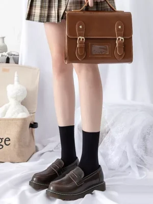 Black sheer lolita ankle socks worn with plaid skirt and brown school bag, demonstrating versatile styling for gothic and classic lolita fashion meetups and events