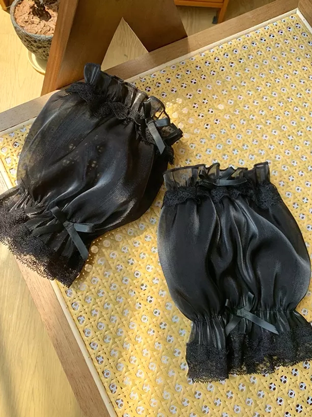 Black shiny organza puff oversleeves with black lace trims and black satin bows, bold alternative Sweet Lolita style