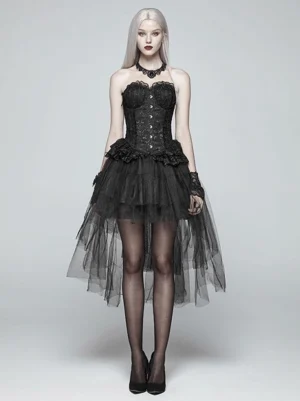 Black steampunk gothic lolita skirt with tiered tulle layers worn by blonde model in full front view, featuring high-low sheer hem, lace corset waist, black choker and stockings