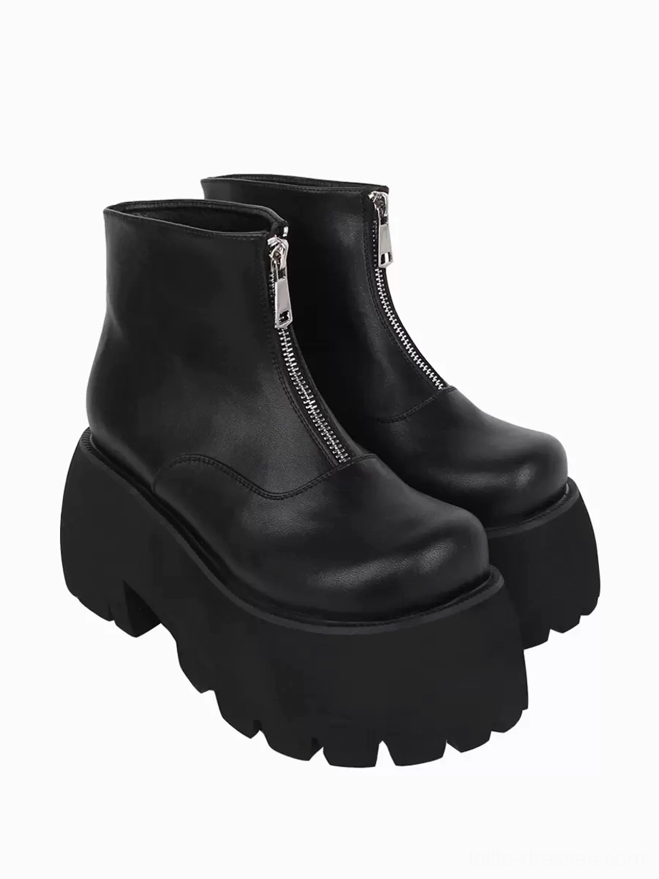 Pair of black platform ankle boots from rear angle showing silver front zippers and structured lug soles steampunk lolita design