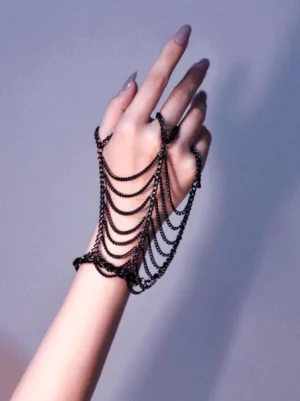 Black metal layered hand chain jewelry steampunk lolita design flat lay wrist finger chain accessory front view