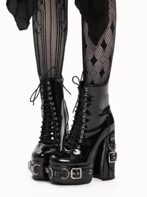 Black steampunk lolita platform boots with patent leather finish, lace-up grommet closure, chunky heel, styled with diamond mesh fishnet stockings front full view