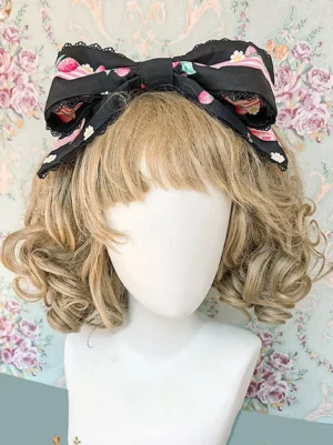 Black sweet lolita bow headdress with strawberry print and lace ruffles, frontal flat view on mannequin with vintage floral wallpaper background, traditional lolita hair accessory
