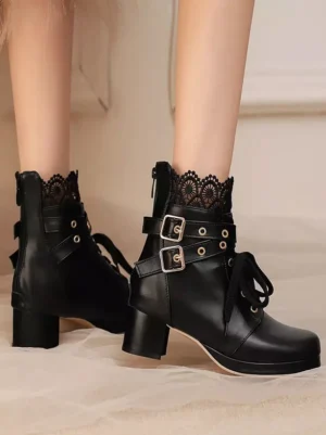Black PU leather sweet lolita ankle boots with dual buckle strap details and polished chunky block heel, front double-leg viewing angle with decorative lace frill socks