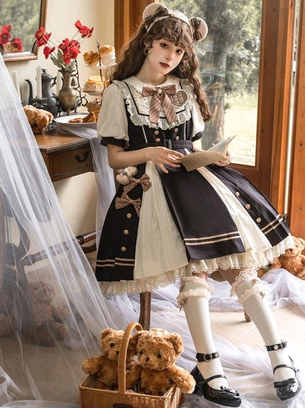 Sweet Lolita dress low-angle full-body shot highlighting lace-trimmed cuffs, belted waist and pleated skirt volume while holding book prop