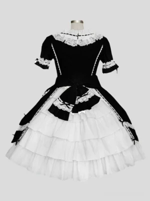 Black sweet lolita dress back view showing tiered ruffled skirt and bow detail with lace trim