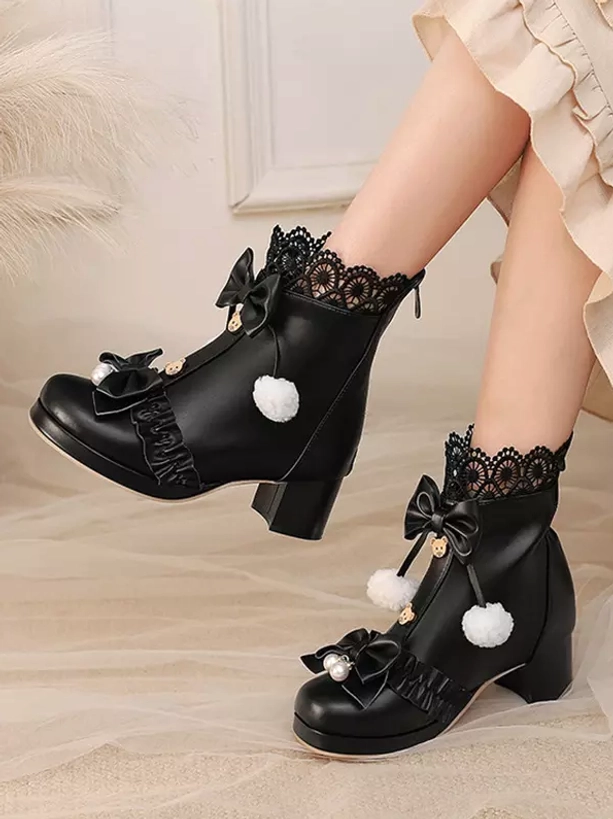 Black Sweet Lolita heeled boots side double on-foot view on soft indoor backdrop, showing black PU leather construction with ruffle and bow decorations