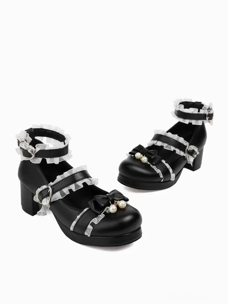 Black Sweet Lolita Mary Jane pumps with pearl bow embellishment and double buckle straps, top-down flat lay still-life shot showing round closed toe design