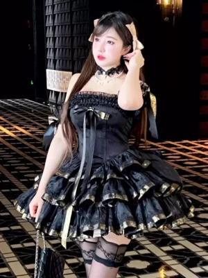 Black off-shoulder lolita dress with satin ribbon bow and tiered ruffles worn by model in three-quarter view with lace choker accessory - sweet lolita coordinate styling