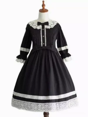Black sweet lolita one-piece dress with white lace trims and ruffled half-sleeves front view on mannequin