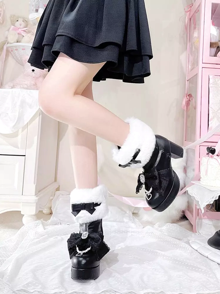 Black sweet lolita platform ankle boots white fur cuff chunky heel detail low side view on pink bedding