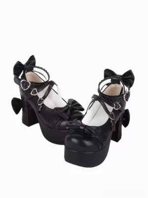 Black sweet lolita platform pumps with multiple satin bows front three-quarter view showing heart-shaped buckles and round toe design