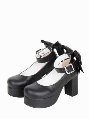 Black sweet lolita platform shoes front three-quarter view with oversized back bow decoration, chunky heel, round toe, and silver ankle buckle strap
