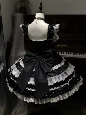 Black sweet lolita princess gown back view showing oversized bow smocked bodice and ruffled shoulder straps
