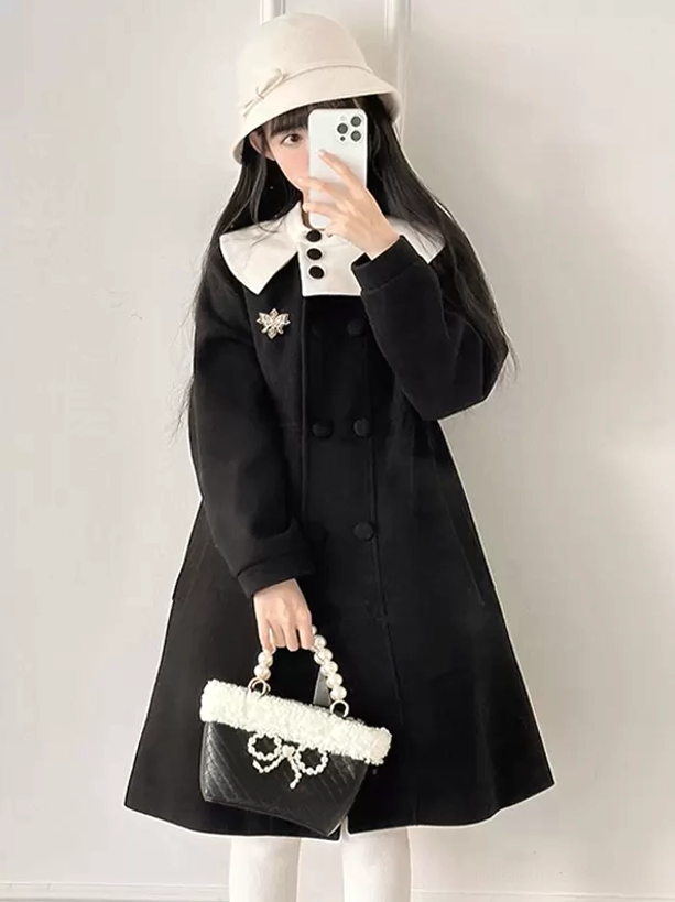 Black Sweet Lolita Rococo overcoat with contrast white Peter Pan collar and double-breasted design worn with beige bucket hat, front mirror view