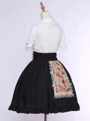 Sweet Lolita tea party skirt back view displaying pleated blouse lace-trimmed apron with bakery print and black A-line silhouette