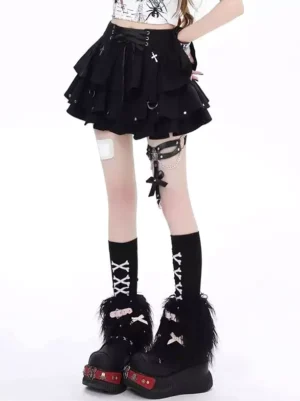 Black layered gothic lolita mini skirt with metal crosses and rivet embellishments styled with XX pattern socks and fuzzy platform boots