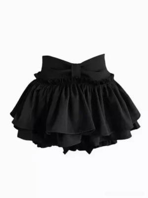 Black tiered ruffle lolita mini skort with large back bow and double-layer ruffled hem, front flat lay view, sweet lolita fashion style