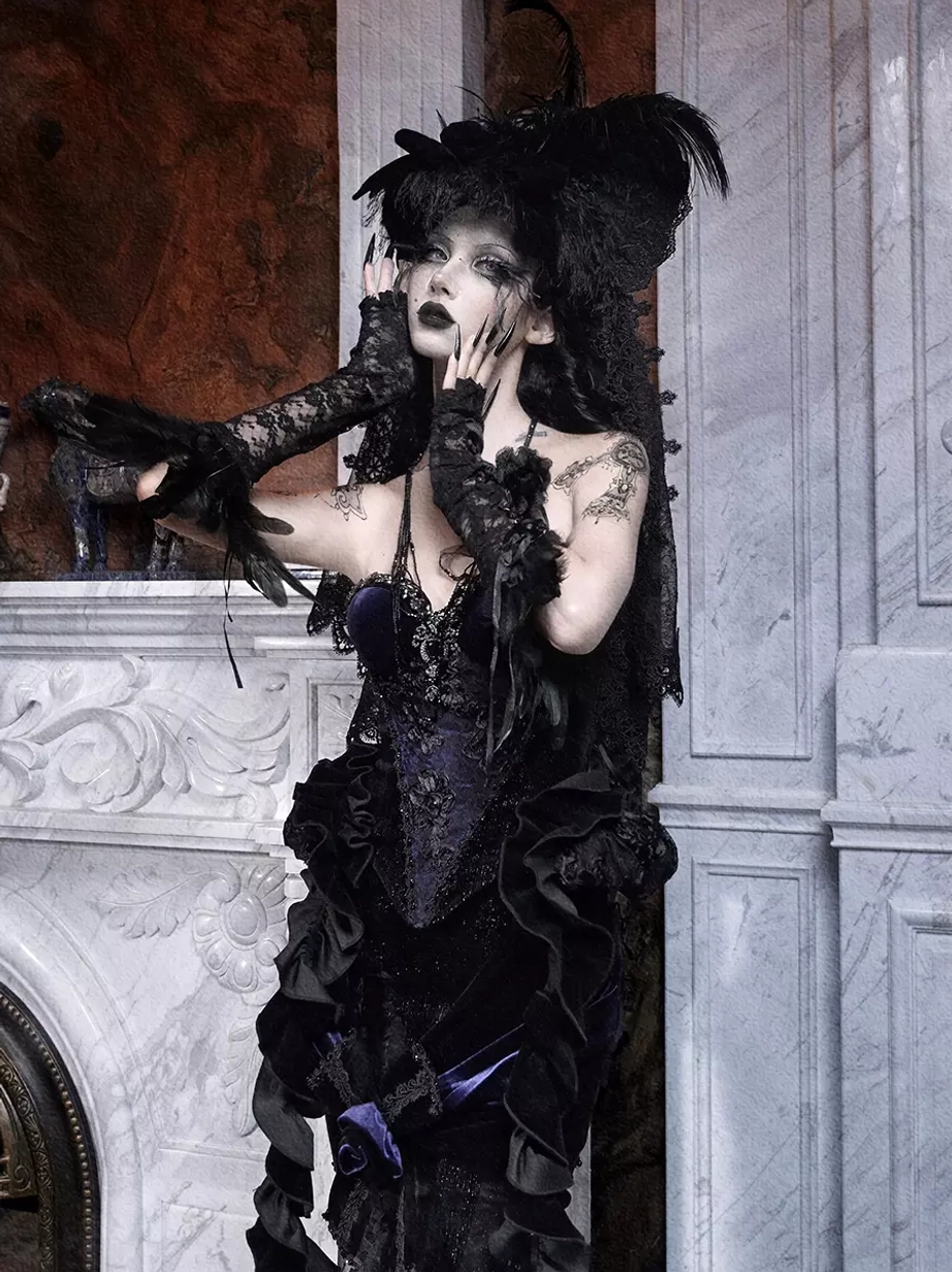 Black velvet gothic lolita corset bustier with ruffled lace trim and crystal details - close-up upper body showing feathered gloves and embellishments
