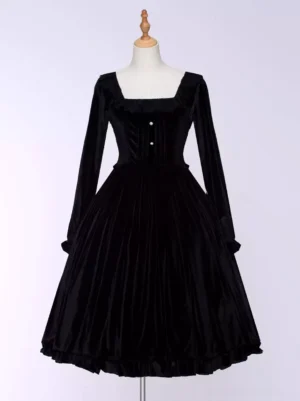 Black velvet Gothic Lolita dress front view on mannequin with square neckline, pearl buttons, and ruffled hem