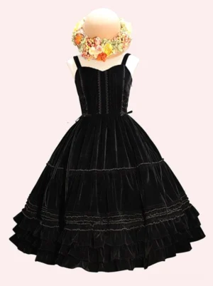 Black velvet sweet lolita jumper skirt with full tiered ruffled skirt, sweetheart neckline, and lace-up bust closure displayed on mannequin mannequin with flower wreath
