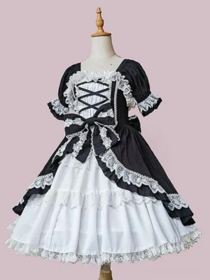Gothic lolita dress front view showing puffed lace-trimmed sleeves, layered ruffled skirt, structured silhouette on dress form with pink backdrop