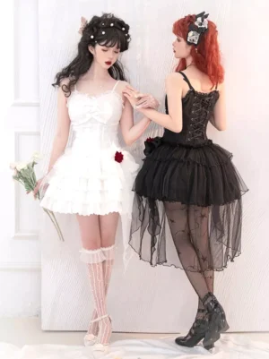 Black and white Gothic Lolita JSK dresses comparison, two models side by side showing corset bodice and ruffled skirt variations