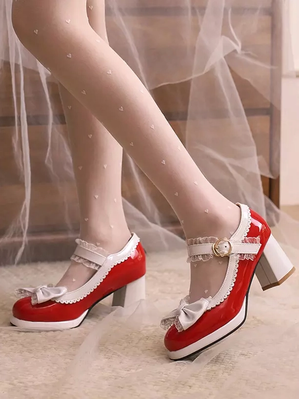 Black-white Lolita Mary Jane pumps with lace-trimmed strap worn on model's feet on wooden dresser background top view