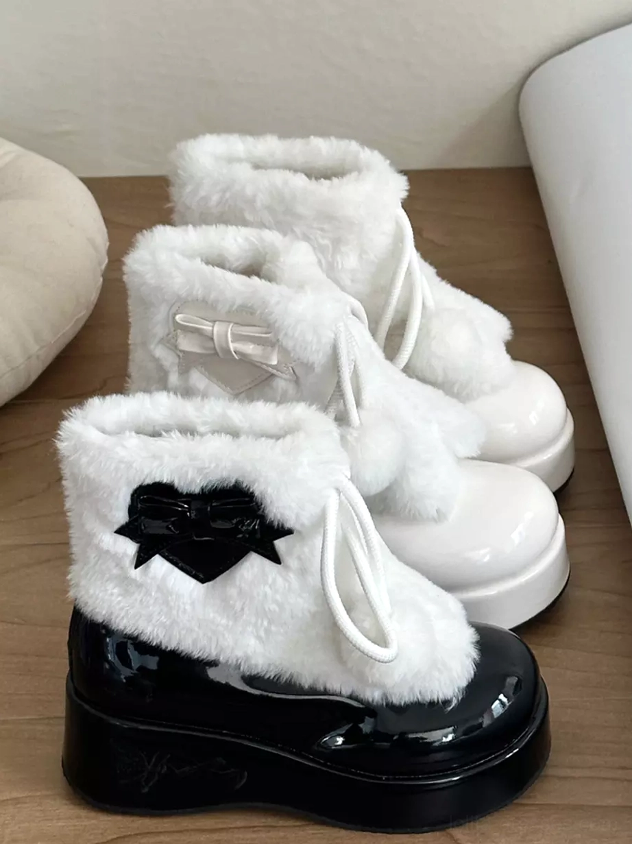 Black and white lolita platform boots rear angle view with mixed bow decorations and pom-pom drawstring
