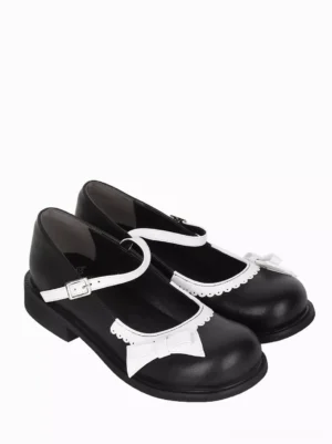 Black and white Mary Jane Lolita pumps reversed paired view showcasing low block heel smooth PU leather and white vamp accents