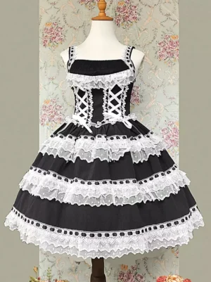Black and white sweet lolita jumper dress sleeveless front view with lace-up closure and white bow accents on dress mannequin