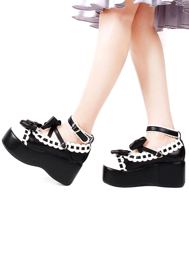 Black and white sweet lolita platform shoes side leg view with ruffled skirt black sole ankle buckle